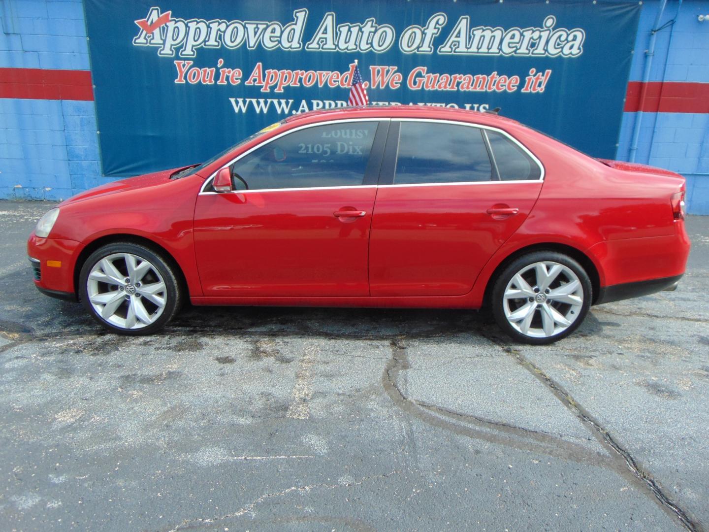 2009 Red Volkswagen Jetta (3VWRM71K49M) with an 5-Cyl 2.5 Liter engine, Automatic, 6-Spd w/Overdrive and Tiptronic transmission, located at 2105 Dixie Hwy, Louisville, KY, 40210, (502) 772-3333, 38.220932, -85.795441 - Photo#0